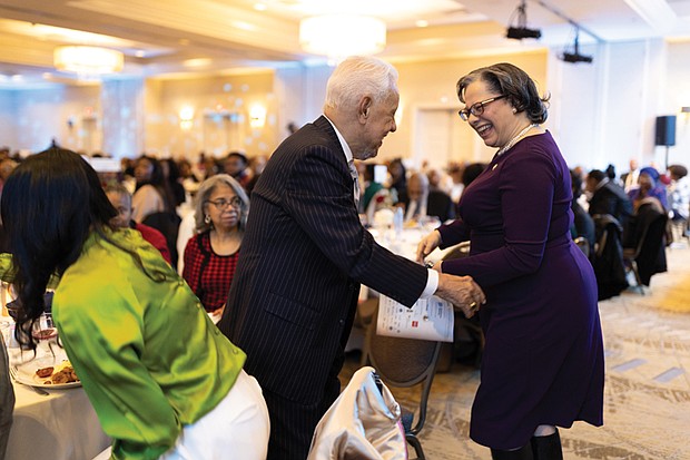Voices raised for peace and change on MLK Day-Richmonders marked Martin Luther King Jr. Day with a series of events, including Virginia Union University’s 47th annual community leaders breakfast, a candlelight vigil for peace outside the Virginia War Memorial, and Lobby Day rallies for gun violence prevention and gun rights at Capitol Square. Congresswoman Jennifer McClellan greets former Gov. Douglas Wilder after her speech at the breakfast. (photo by Julianne Tripp Hillian/Richmond Free Press)
