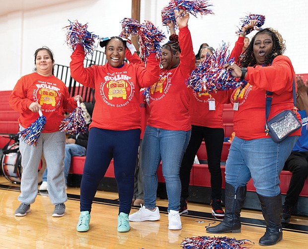Rolling Rally celebrates unity, inclusion-Students, faculty and community
supporters came together Jan. 16 for the first RPS Unified Champion Schools Rolling Rally, a celebration of school pride, inclusion and teamwork. The event featured a multistop bus tour visiting five schools, culminating at Thomas Jefferson High School with music, games and the unveiling of a new Special Olympics Virginia slogan, “Live with Unity. Lead with Inclusion.” Richmond High School of the Arts students Viki Monzon, Zandra Johnson and Darneja Williams cheer alongside UCS adviser Diane Herson as the Rolling Rally stops at TJHS, energizing fellow students and participants.(photo by Julianne Tripp Hillian/Richmond Free Press)