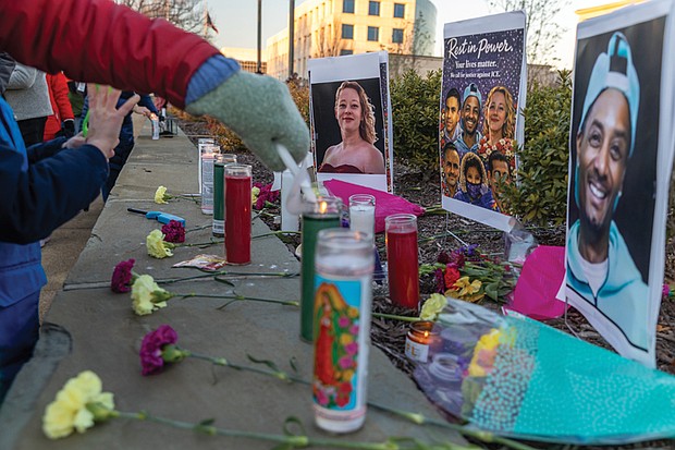 Voices raised for peace and change on MLK Day-Richmonders marked Martin Luther King Jr. Day with a series of events, including Virginia Union University’s 47th annual community leaders breakfast, a candlelight vigil for peace outside the Virginia War Memorial, and Lobby Day rallies for gun violence prevention and gun rights at Capitol Square. MLK Vigil and protest at War Memorial- The event was also a protest of Trump administration policies and deaths linked to ICE activity. Candles, flowers and photos of Renée Good, Keith Porter and other people killed in
ICE-related incidents were placed outside the Virginia War Memorial in remembrance.(photo by Julianne Tripp Hillian/Richmond Free Press)