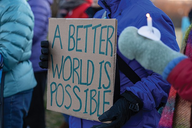 Voices raised for peace and change on MLK Day-Richmonders marked Martin Luther King Jr. Day with a series of events, including Virginia Union University’s 47th annual community leaders breakfast, a candlelight vigil for peace outside the Virginia War Memorial, and Lobby Day rallies for gun violence prevention and gun rights at Capitol Square. MLK Vigil and protest at War Memorial- The event was also a protest of Trump administration policies and deaths linked to ICE activity. People gather with candles and signs bearing hopeful messages during the vigil outside the Virginia War Memorial.(photo by Julianne Tripp Hillian/Richmond Free Press)