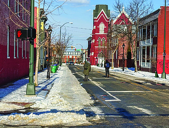 Pedestrians in Richmond’s Jackson Ward neighborhood walk on streets Wednesday to avoid icy sidewalks after a weekend winter storm.