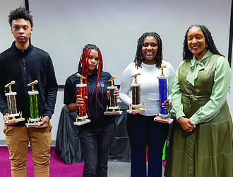 Winners of the MLK Jr. Oratorical Contest at Virginia Union University on Saturday, Jan. 24, pose with School Board member Shavonda Fernandez. From left, Te’Ron Jefferson, a 12th-grade student at Huguenot High School, placed third; Jakayla “Kayla” Parker, a 10th-grade student at Open High School, placed second; and Renashea Hunt, a 12th-grade student at John Marshall High School, placed first