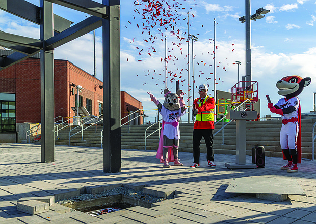 Flying Squirrels place time capsule- Marking 40 years of baseball history and commemorating the transition from The Diamond, the Richmond Flying Squirrels held a ceremony Jan. 22 to place a time capsule at CarMax Park. The capsule includes curated items from the team’s 2025 season at The Diamond, along with relics from the Flying Squirrels and the former Richmond Braves, including items donated by fans last fall. A date for when the capsule will be opened has not been set. (photo by Julianne Tripp Hillian/Richmond Free Press)