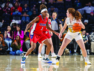 Laia Crespín (22) of Virginia Commonwealth University’s women’s basketball team defends the ball against Alicia Newell (3) of hometown rival Richmond at the Siegel Center on Feb. 1 during the third annual SupportHER game.