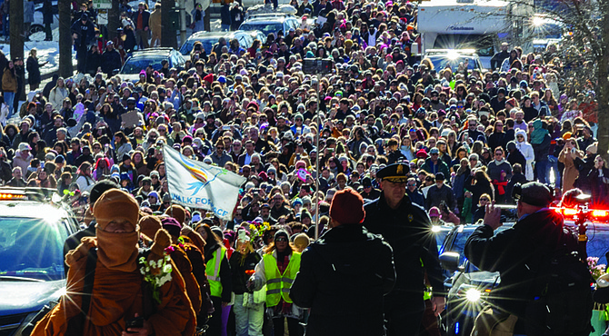Buddhist monks walk through Richmond on Monday, Feb. 2, the 100th day of their Walk for Peace, crossing from South Side over the Manchester Bridge. Thousands followed as the group made its way to City Hall, where the monks shared messages of mindfulness and peace with visitors from Richmond and neighboring cities and states.
