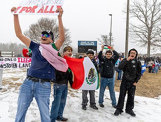 Yosmani Rafael Valdez, left, and other students at Lloyd C. Bird High School walk out of the school into snowy weather during a student-led demonstration Friday, Feb. 6, from 2:15 to 2:55 p.m. The walkout was part of coordinated demonstrations at high schools across Chesterfield County Public Schools focused on immigration issues.