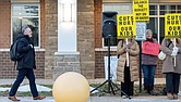 Superintendent Jason Kamras watched as members of the Richmond Education Association rallied outside River City Middle School on Monday to protest proposed cuts in the school division’s fiscal year 2027 budget ahead of a Richmond School Board town hall meeting. Julianne Tripp Hillian/Richmond Free Press