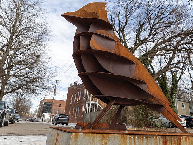 Cityscape-Slices of life and scenes in Richmond-“Cardinal Points,” a 7-foot steel sculpture by Richmond artist Noah Scalin, is now on display near the end of South Addison Street in the Fan, where the Downtown Expressway cut through historic neighborhoods. The work depicts Virginia’s state bird and reflects on the lasting impact of redlining and highway construction on Richmond communities. The sculpture was commissioned by Markham Planning. (photo by Julianne Tripp Hillian/Richmond Free Press)