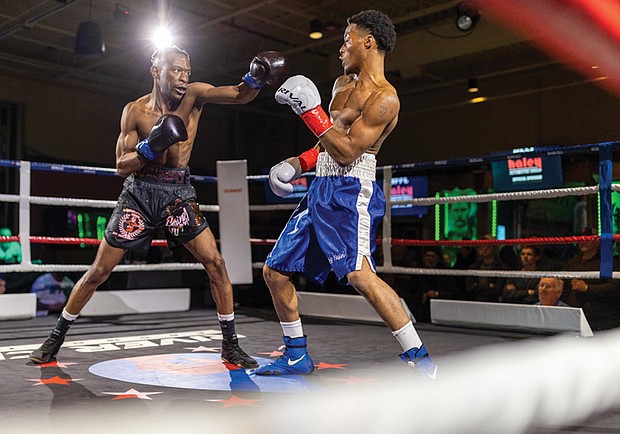 Between the ropes-On Feb. 4, Great American Ranch in Midlothian
hosted a charity boxing event supporting Guardian
of the Gloves. The series will continue monthly through 2026, featuring WBC champions, Olympic medalists, international fighters and local professionals. Adu-Aziz Valadez Ya-Sin, in the blue trunks, squares off against Jonathan Freeman. (photo by Julianne Tripp Hillian/Richmond Free Press)