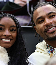 Simone Biles and her husband, NFL player Jonathan Owens, attend a hockey match at the Olympics in Milan, Italy.
