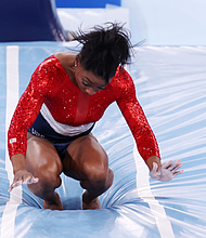 Simone Biles stumbles on a vault landing during the Tokyo Olympics in 2021.