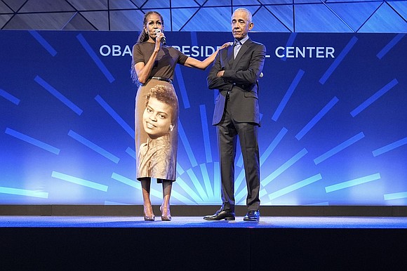 Michelle Obama honored her late mother with a custom portrait skirt during an emotional appearance at the Obama Presidential Center.