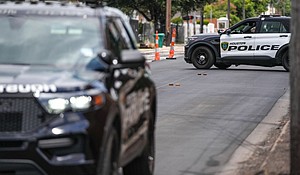 Police investigate after a shooting in Houston Tuesday.