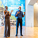 Former President Barack Obama and former first lady Michelle Obama welcome communit members in the Hope and Change lobbu before they walked through the museum at the new Presidential Center
