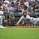 Detroit Tigers Riley Greene dives to home and scores off a two-run single from Colt Keith against the Seattle Mariners on Tuesday.