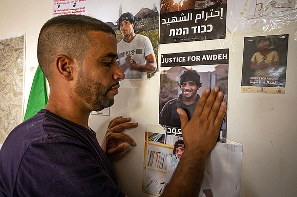 Israeli prosecutors have charged a West Bank settler with reckless manslaughter in the fatal shooting of Palestinian activist Odeh Hathalin, …
