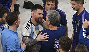 Lionel Messi with his father