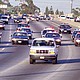 California Highway Patrol chase Al Cowlings (driving) and O.J. Simpson, hiding in rear of the white Bronco, on June 17, 1994 in Los Angeles.