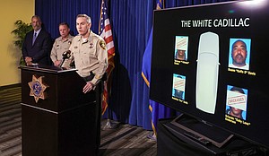 From left, Clark County District Attorney Steve Wolfson, Clark County Sheriff Kevin McMahill and Las Vegas Metropolitan Police Department Lt. Jason Johansson