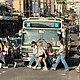 A tourist group crosses the street near the Yasaka Shrine in Osaka.