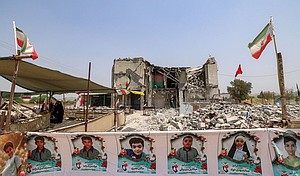 The building of the destroyed Shajareh Tayebeh elementary school, surrounded by rubble in Minab, Iran, on August 10.