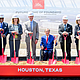 Officials pose at the groundbreaking of Eli Lilly and Co.'s $6.5B biomanufacturing facility at Generation Park in Houston on Monday