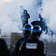 Police officers fire tear gas at protesting students near the Kerichen high school in Brest, France, on Friday.