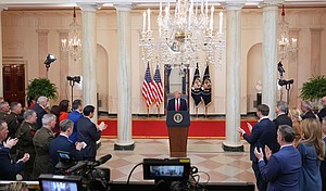 President Donald Trump concludes the address from the Cross Hall of the White House on April 1 in Washington, DC.