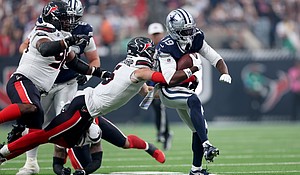 The Houston Texans' Reed Blankenship tackles the Dallas Cowboys' Ryan Flournoy on Sunday.