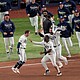 Tampa Bay's Ben Williamson is mobbed by teammates after his game-winning hit.