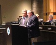 Joliet Mayor Tom Giarrante, who lost his re-election bid in April, offers an emotional goodbye speech to his family, friends, staff and other in attendance at his final council meeting Monday.