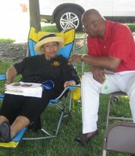 State Rep. Constance Howard and Illinois Appellate Court Justice P. Scott Neville, Jr. chat during the Save the Children95 annual picnic.   (Photo by Thelma Sardin)
