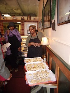 Lenore Lindsey, owner of Give Me Some Sugah Bakery located at 2234 E. 71st mingle with visitors during the Buy Black Business Day Tour.