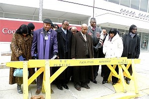 Members and supporters of Clergy For Community Change, led by its president, Rev. Kenyatta Smith, center, held a prayer vigil Dec. 28 outside the Cook County Juvenile Temporary Detention Center, 1100 S. Hamilton Ave. Also attending was Bob Love, Chicago Bulls community relations director. The vigil was held to send a message to the youth held there that they are loved and are not forgotten. (Photo Credit:Chinta Strausberg)