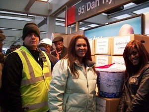 Jil Ross (center)  and her daughter Jace (right) pick up food boxes donated to local families by CTA.  (Photo Courtesy of Jil Ross)