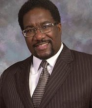 Friday, Rev. Marshall Hatch (shown above) of New Mt. Pilgrim Missionary Baptist Church led members of the Leaders Network in a prayer vigil outside the Cook county medical examiners office on the West Side in hopes of improving conditions in the morgue there.  Complaints about the conditions at the facility date back to 2010.