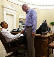 President Barack Obama and Vice President Joe Biden shake hands in the Oval Office following a phone call with House Speaker John Boehner securing a bipartisan deal to reduce the nation's deficit and avoid default, Sunday, July 31, 2011. (Official White House Photo by Pete Souza)