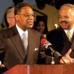 Dr. Henry Givens, Jr. shares his plans to retire as president of the Harris-Stowe State University on Tuesday, as Board of Regent member Wayman Smith stands in support. The announcement came at a mid-morning press conference in the university's Bank of America Theatre.