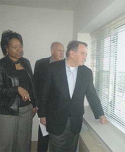 Mayor Richard M. Daley (right), Phil Mappa, managing director of MR Properties, and Eighth Ward Ald. Michelle Harris look outside a window of one of 102 affordable units during an official grand opening ceremony at the new Montclare Senior Apartments of Avalon Park.